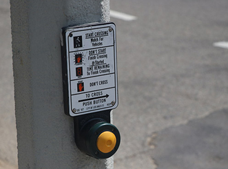 Image of a crosswalk button taken at a low aperture