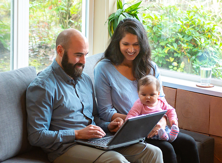 Family looking at laptop Family looking at laptop