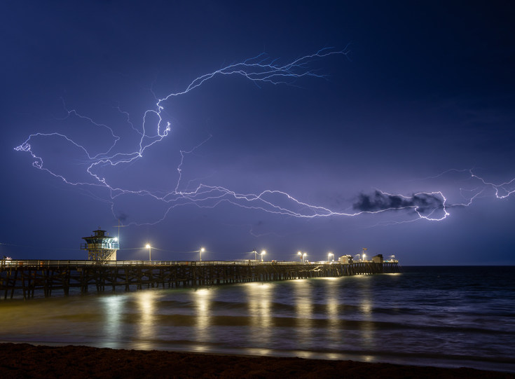 Lightning over pier at night Lightning over pier at night