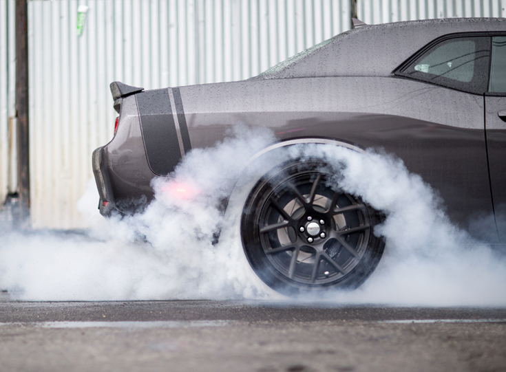 Smoke from squealing car tires Smoke from squealing car tires