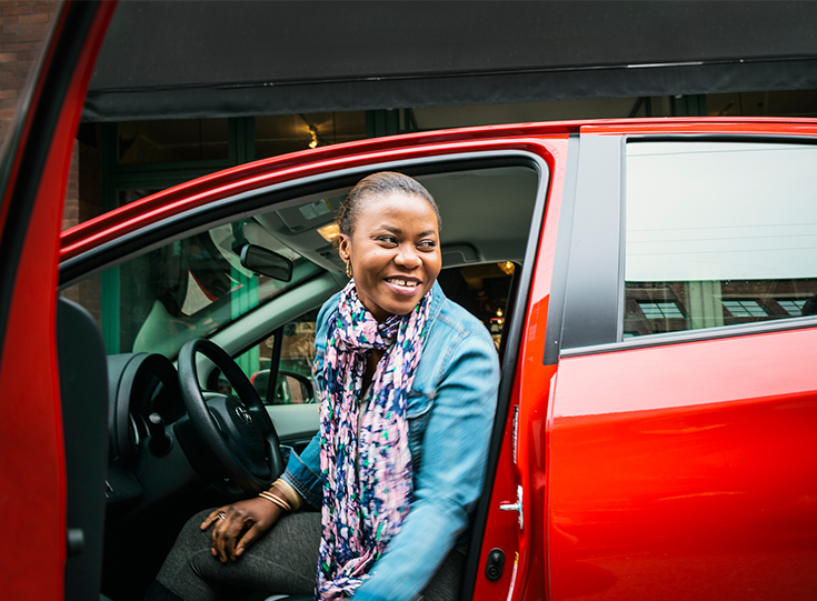 woman in a red vehicle woman in a red vehicle