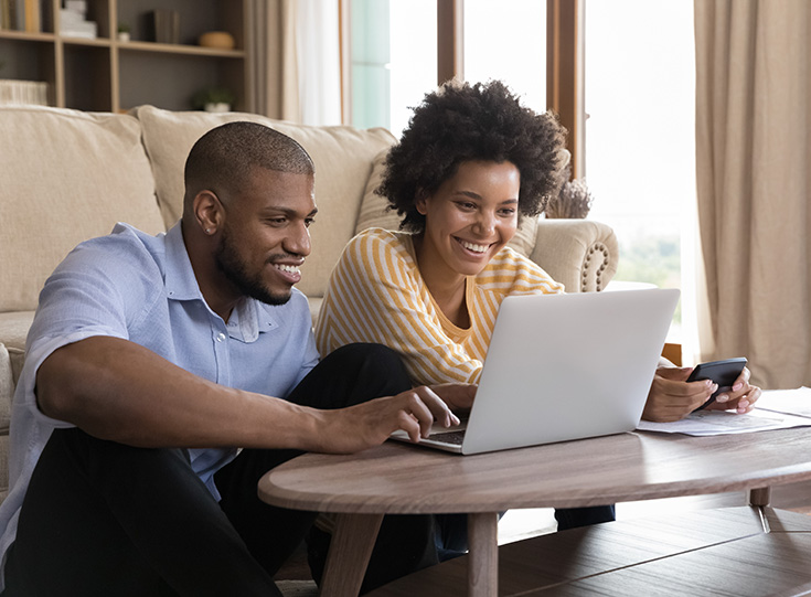 A couple shopping online for car insurance A couple shopping online for car insurance