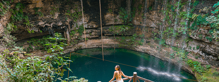 Woman at a cenote in Yucatan Peninsula Woman at a cenote in Yucatan Peninsula