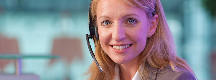 An agent wearing a headset An agent wearing a headset
