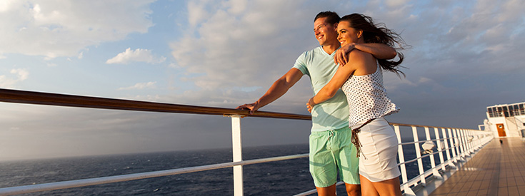 Couple standing on deck of cruise ship Couple standing on deck of cruise ship
