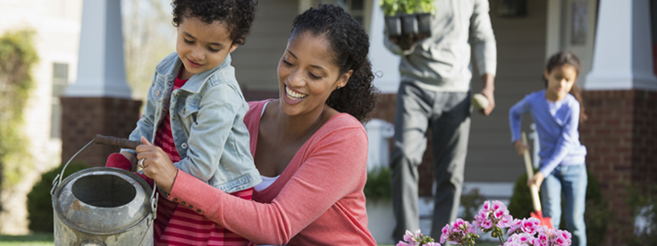 Family planting flowers home Family planting flowers home