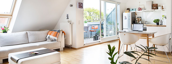 Woman setting burglar alarm Woman setting burglar alarm