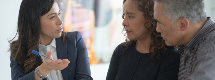 Couple talking to claims agent Couple talking to claims agent
