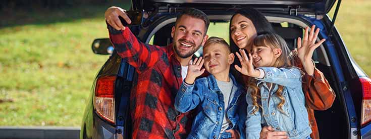 Young family takes selfie on road trip Young family takes selfie on road trip