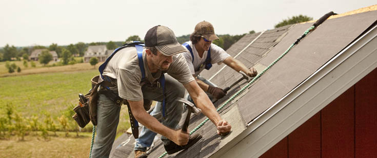 2 people work on a construction job together 2 people work on a construction job together