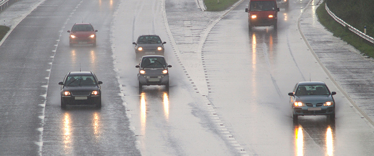 Cars driving in the rain Cars driving in the rain