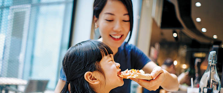 Mom and daughter eating Mom and daughter eating