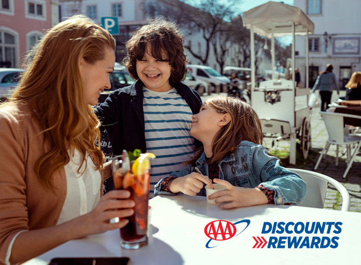 Mother with children sitting outdoors at a restaurant Mother with children sitting outdoors at a restaurant