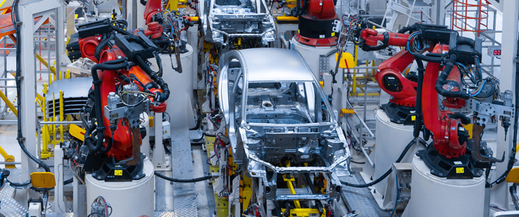 Cars being built in factory Cars being built in factory
