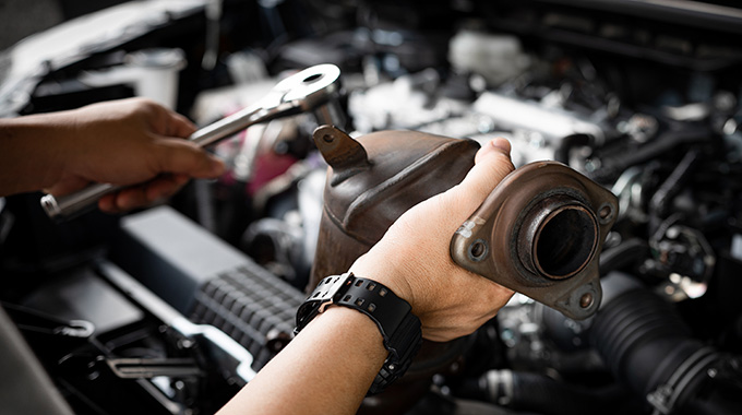 Catalytic converter being removed.