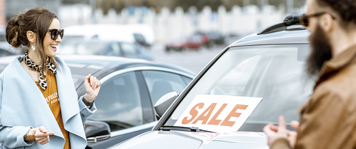Couple on used car lot Couple on used car lot