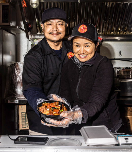 Phonexay and Margaret Phoutasen inside their food truck