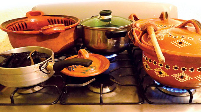 Traditional dishes simmering atop Lily’s stove. | Photo by Rick and Mimi Steadman