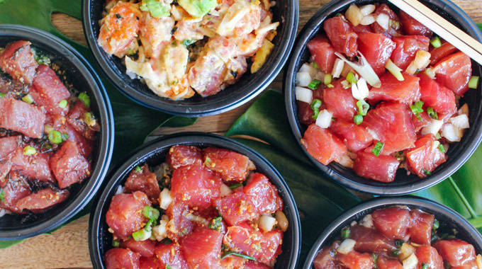 A spread of 5 bowls with different types of poke from Foodland Farms
