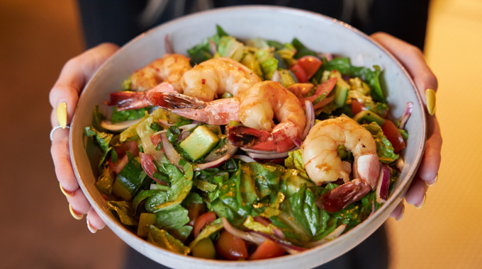 Thai salad topped with sauteed shrimp