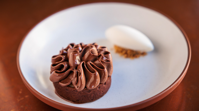 Chocolate tart with a scoop of ice cream