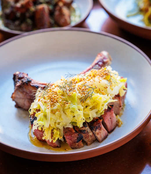 Ibérico pork chop topped with cabbage and fennel pollen