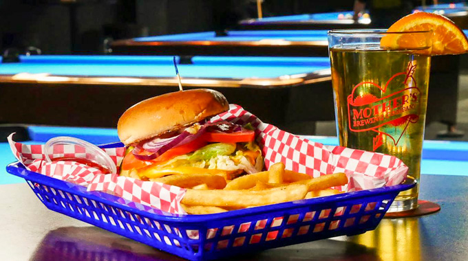 Billiards of Springfield burger served in a basket with fries