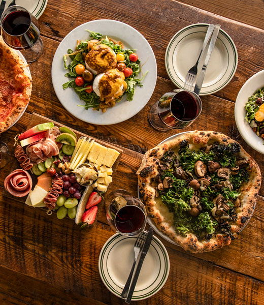 Dodici Pizza & Wine pizza, salad, and charcuterie board.
