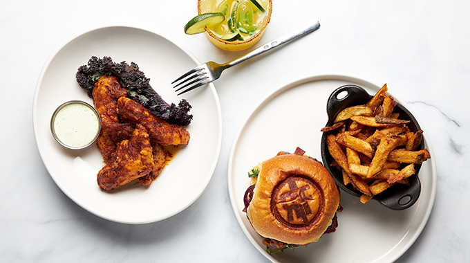 Nashville hot chicken strips and drunken goat burger and fries from The Rustik Fork Eatery in Riverside.