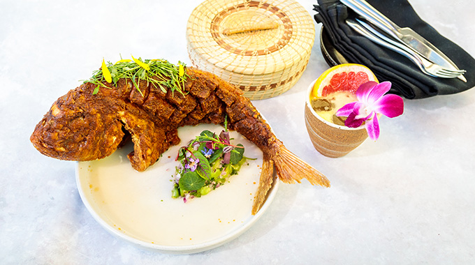 Whole fried Baja snapper plated with herbs