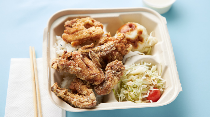 Fried chicken wings and thighs served with coleslaw