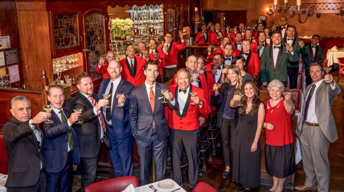 Musso & Frank's employees toasting their drinks