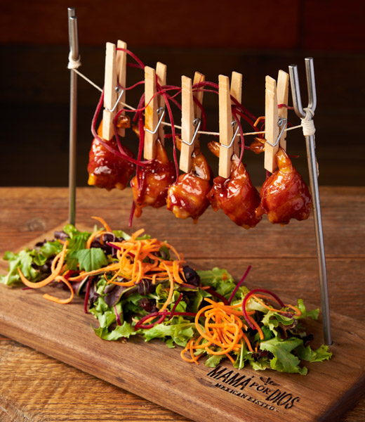 Clothespins holding shrimp on a miniature clothesline