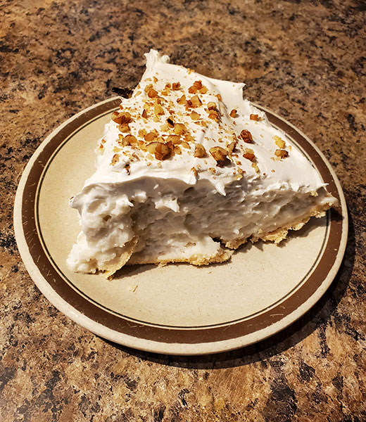 A plated slice of White Pie from Burton's Cafe