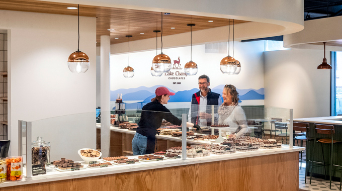 Visitors at the counter inside Lake Champlain Chocolates.