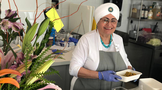 Mata G. preparing food at her eponymous restaurant