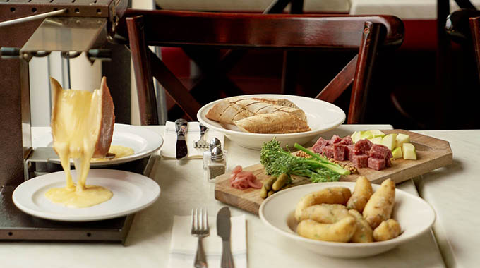 Cheese raclette for two at Petite Jacqueline. | Photo courtesy Petite Jacqueline