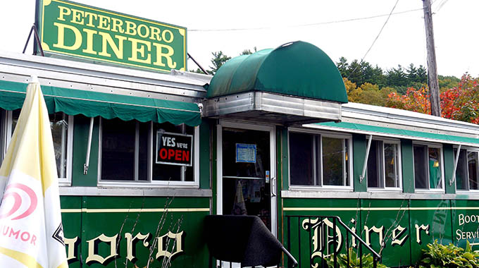 The open sign in the window beckons visitors to Peterboro Diner
