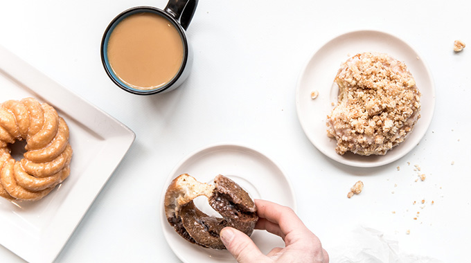 Someone holding a doughnut