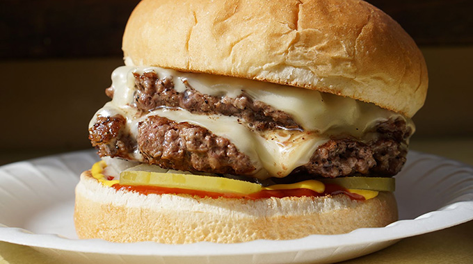 A burger with double patties and cheese