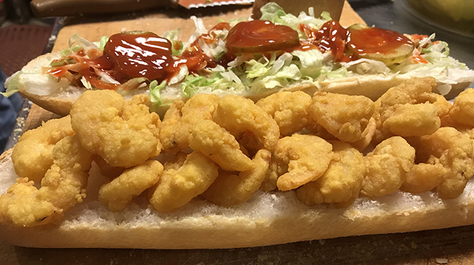 Domilise po-boy piled high with shrimp