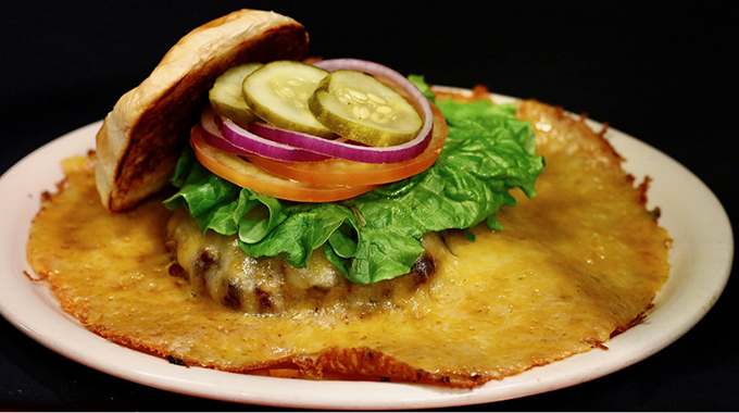 The Cheese Volcano Burger fills an entire plate