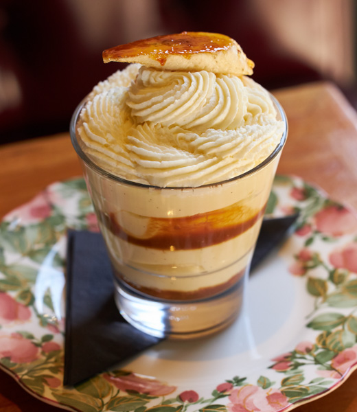 Banana pudding layered in a glass cup