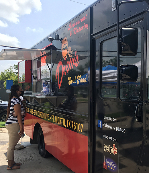 Customer ordering at Drew's Place food truck