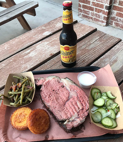 Prime rib, green beans, cucumber salad, and cornbread at Evie Mae's Barbecue. | Photo courtesy Evie Mae's Barbecue