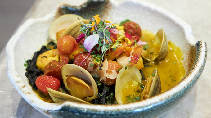 Clam and shrimp pasta with black ink linguini in a lemon wine sauce