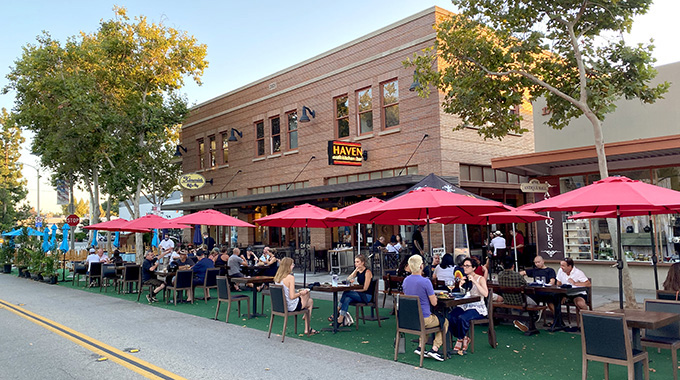 Diners enjoy lunch outside Haven Craft Kitchen + Bar in Old Towne Orange. | Photo by Eric Van Eyke