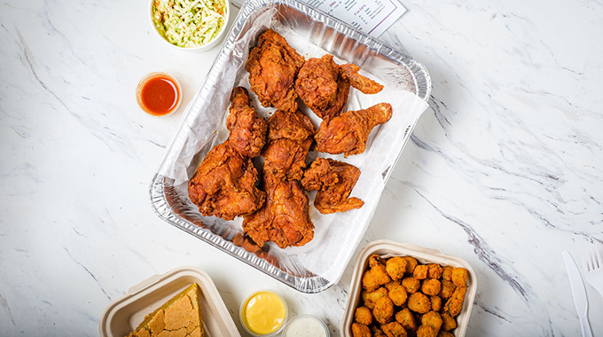 Fried chicken, fried okra, coleslaw, and chess pie at Gus’s World Famous Fried Chicken in Santa Ana.