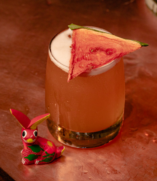 Blind Rabbit cocktail topped with a slice of dehydrated watermelon.