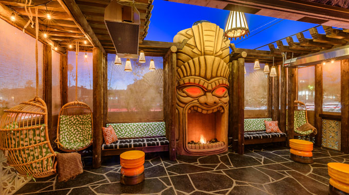 The Grass Skirt patio featuring a tiki-shaped fireplace.